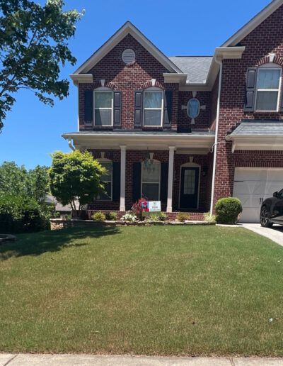 A home, specifically its lawn, after it has been serviced by Absolute Green Landscaping