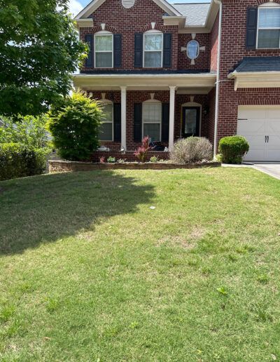 A home, specifically its lawn, after it has been serviced by Absolute Green Landscaping